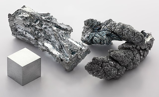 Zinc_fragment_sublimed_and_1cm3_cube Zinc_fragment_sublimed_and_1cm3_cube